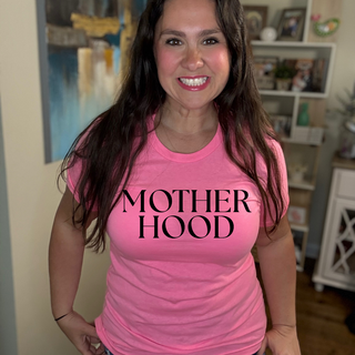 Nicole wearing a bright pink motherhood tee