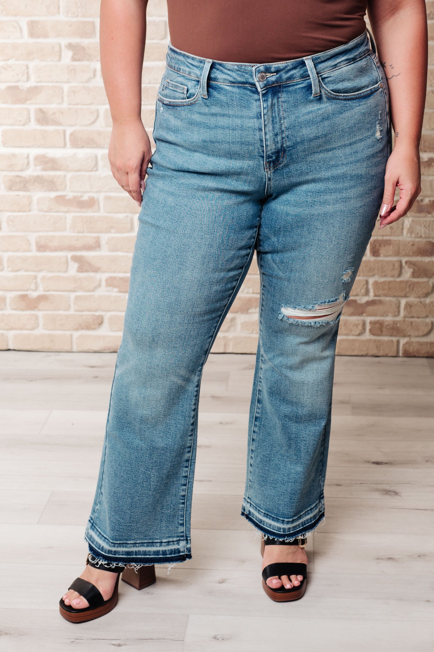 Isla Mid Rise Distressed Released Hem Bootcut Jeans MadreForte LLC