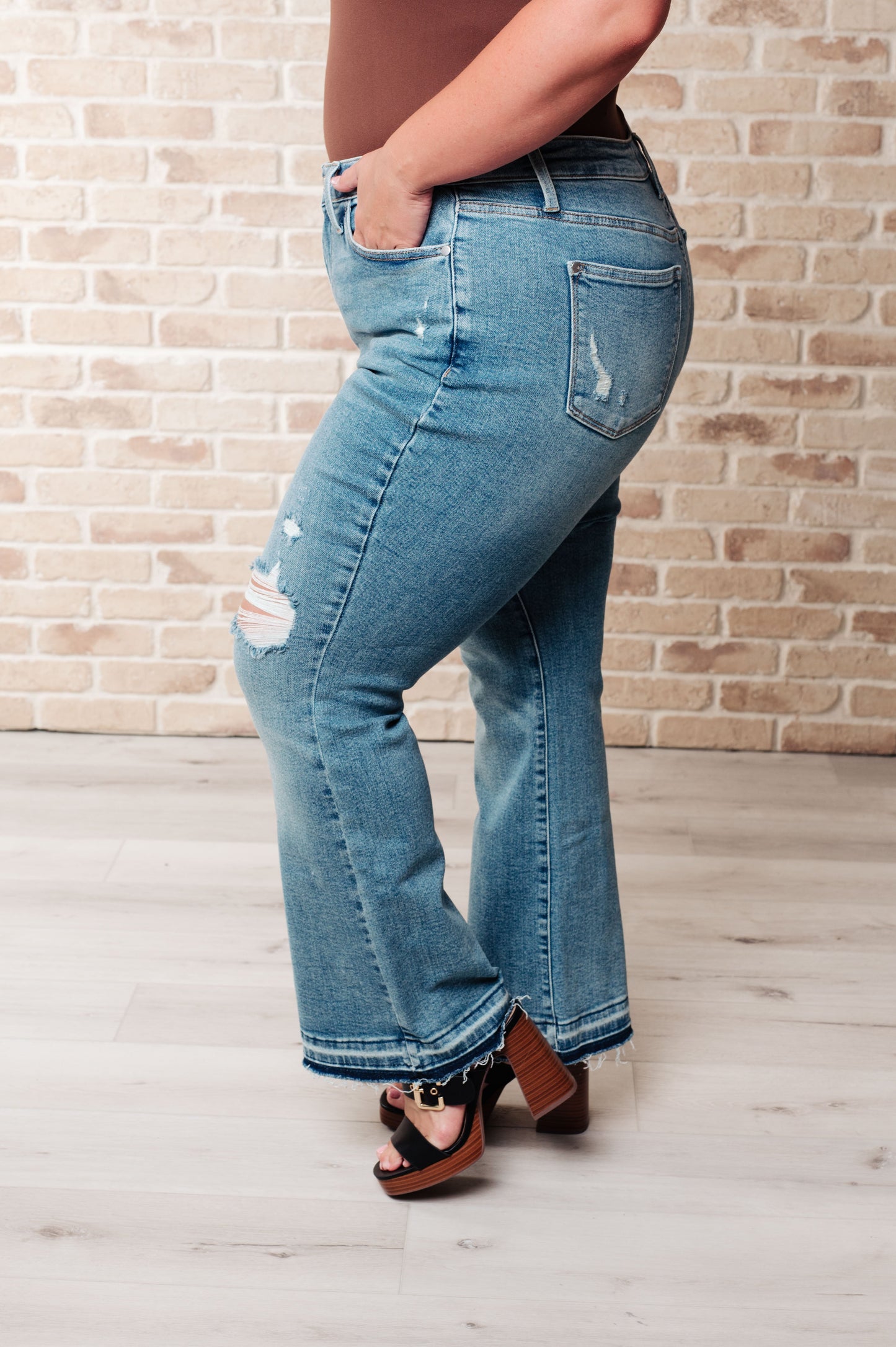 Isla Mid Rise Distressed Released Hem Bootcut Jeans MadreForte LLC