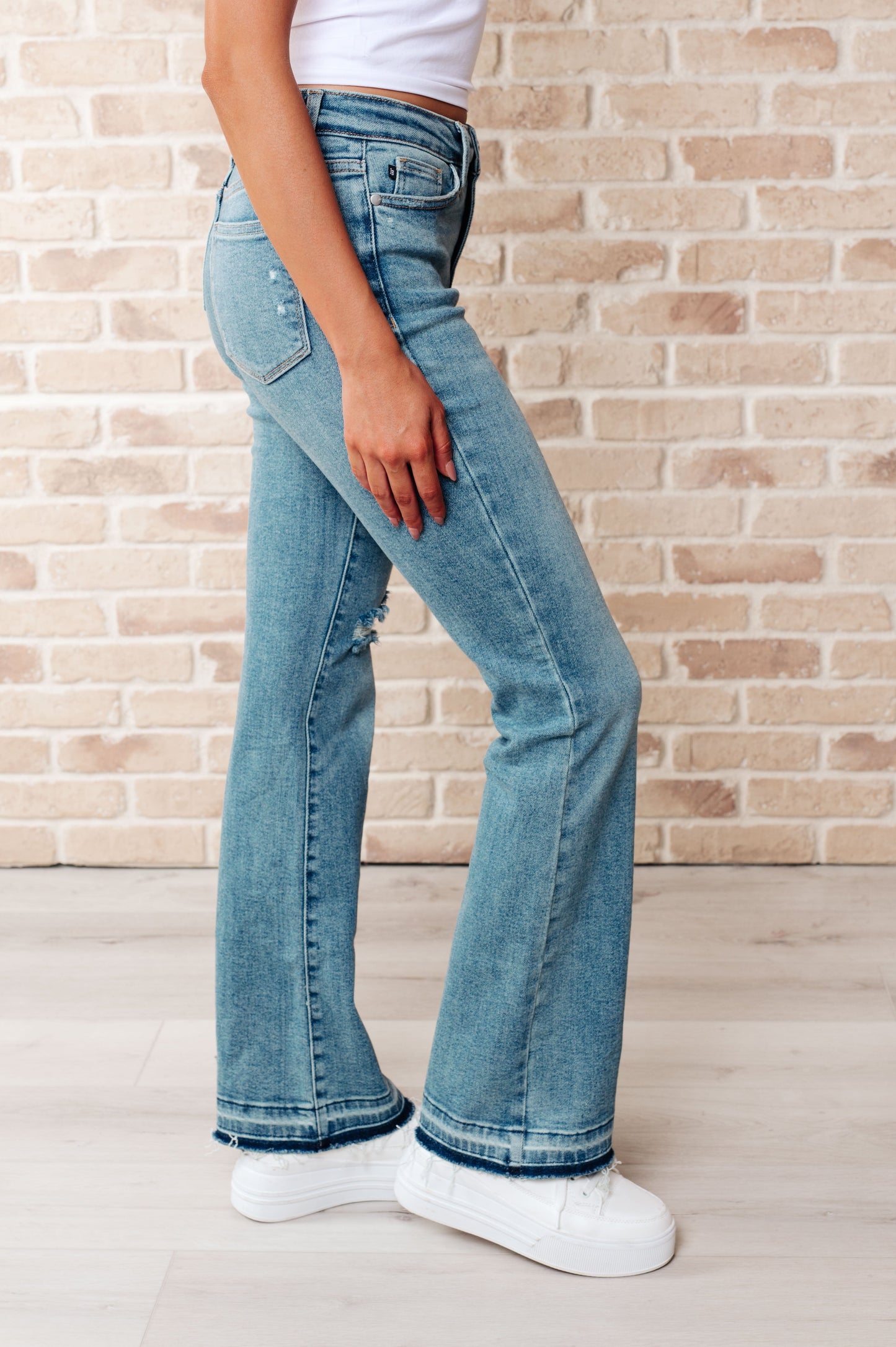 Isla Mid Rise Distressed Released Hem Bootcut Jeans MadreForte LLC