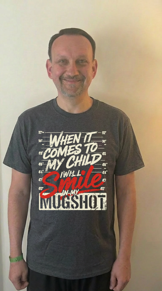 When it comes to my child I will smile in my mugshot Tee