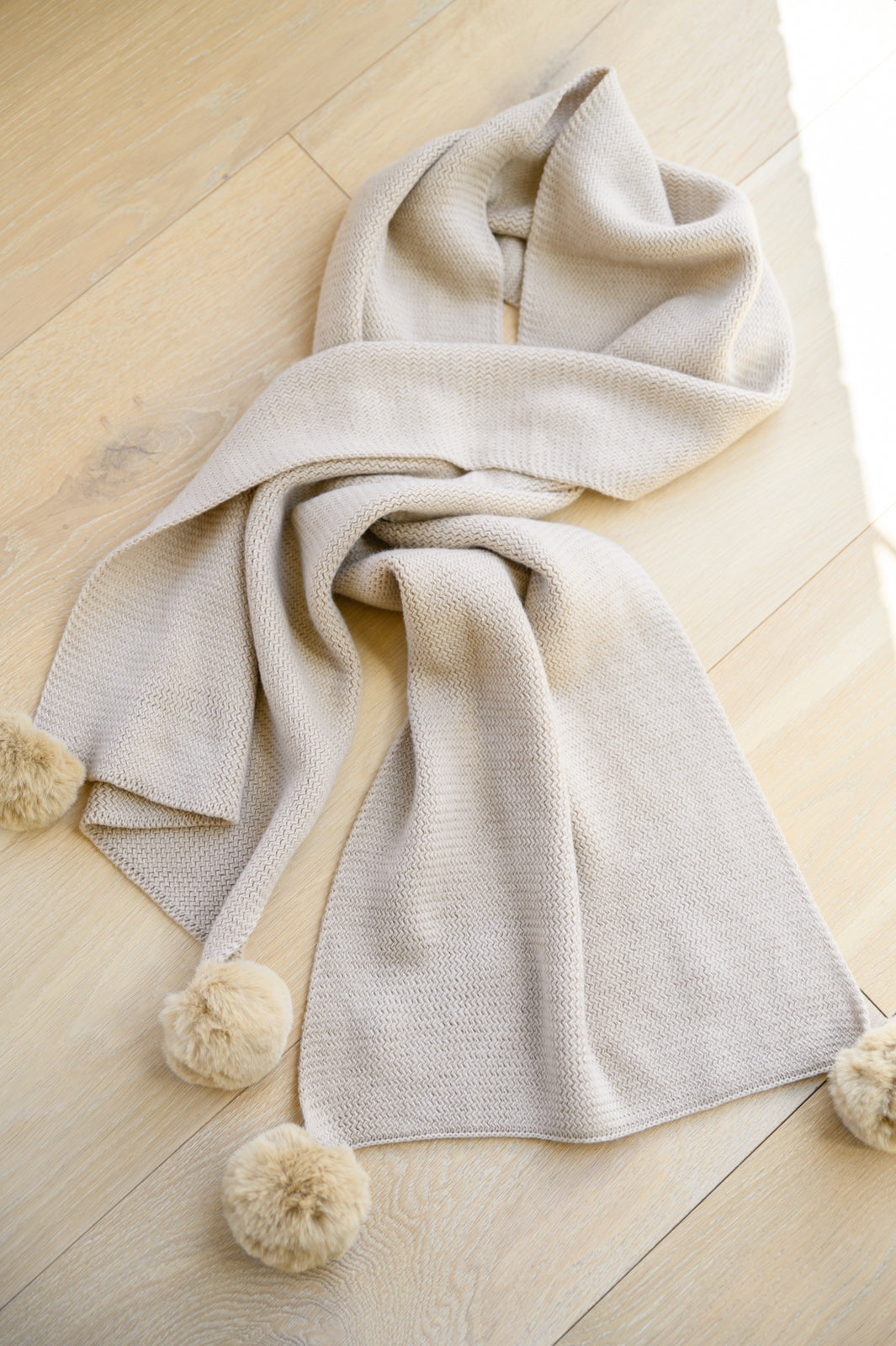 Knitted Fuzzy Pom Pom Scarf In Beige MadreForte LLC