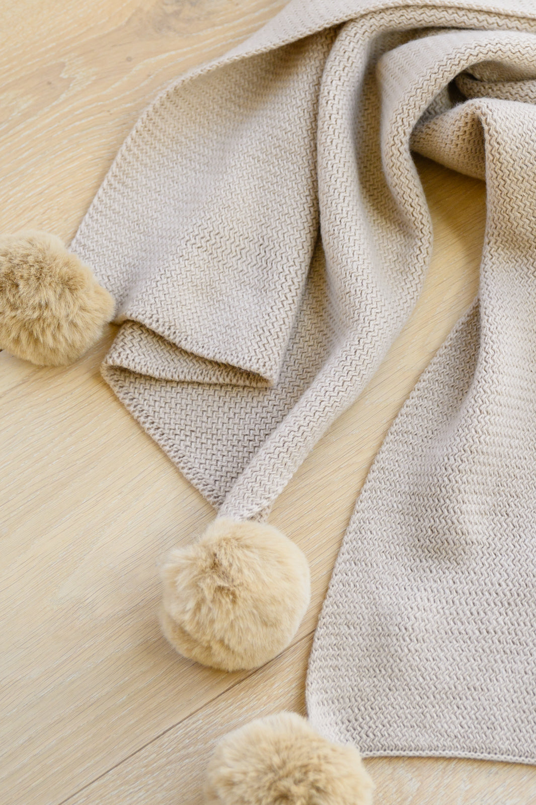 Knitted Fuzzy Pom Pom Scarf In Beige MadreForte LLC