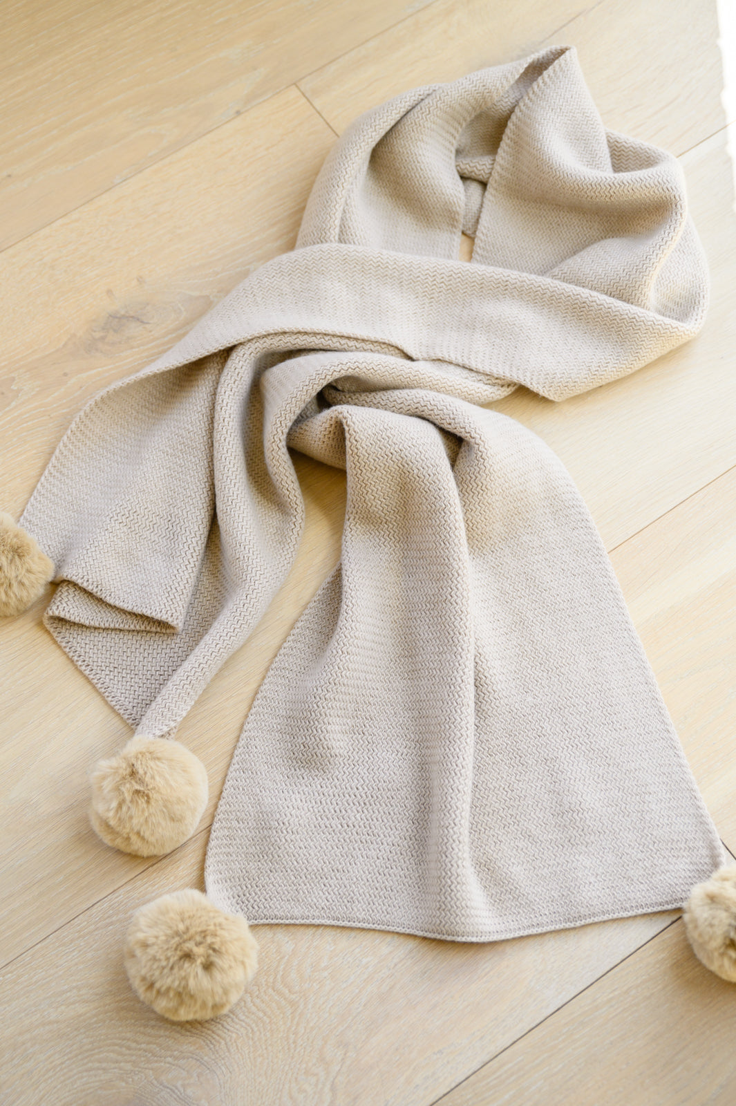 Knitted Fuzzy Pom Pom Scarf In Beige MadreForte LLC