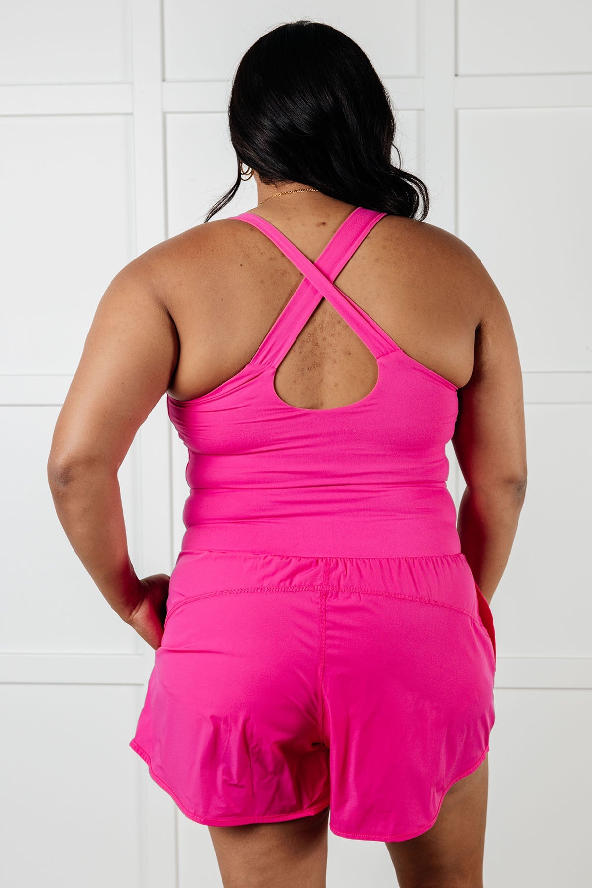 Raising Heart Rate Cutout Runsie In Sonic Pink MadreForte LLC