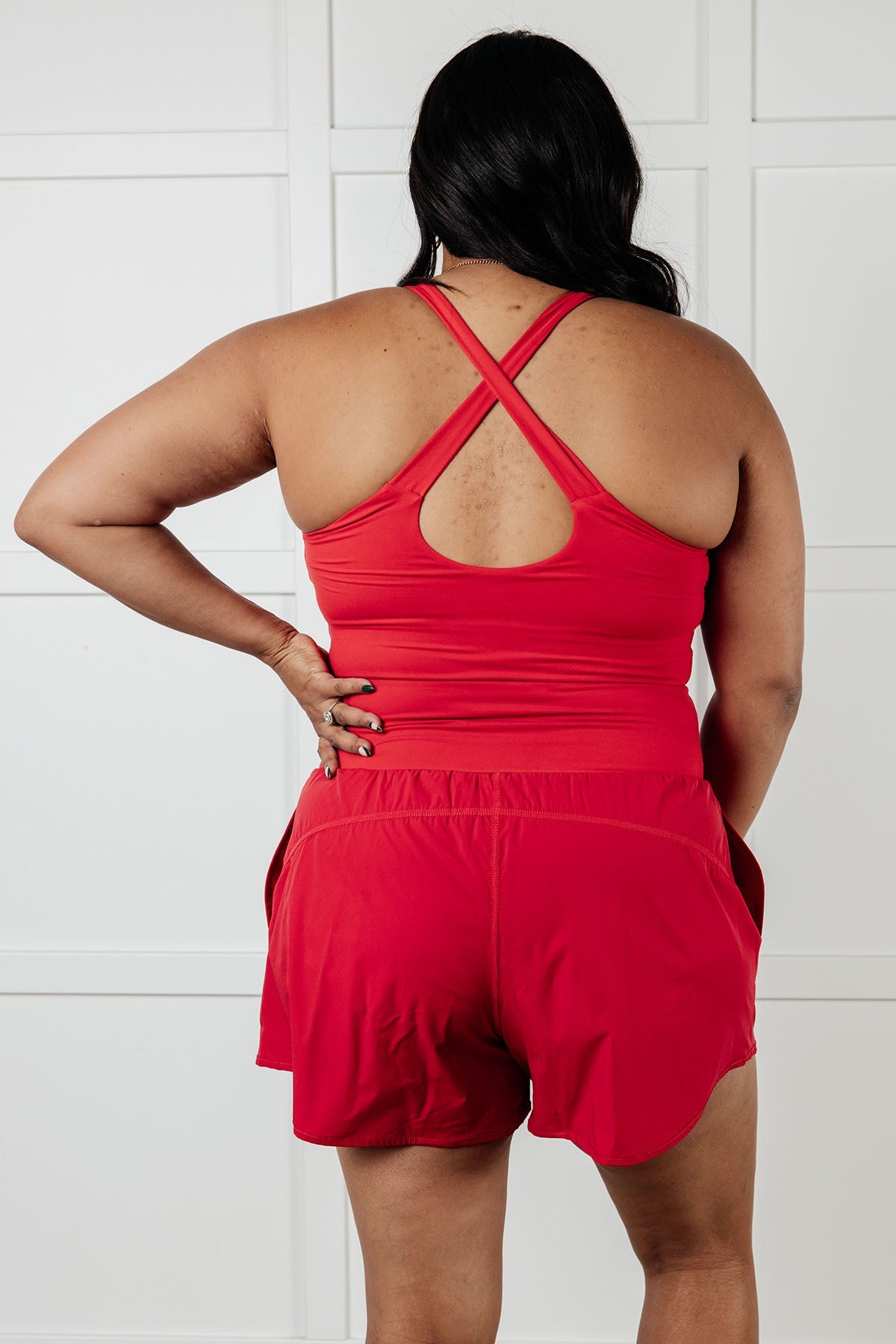 Raising Heart Rate Cutout Runsie In True Red MadreForte LLC